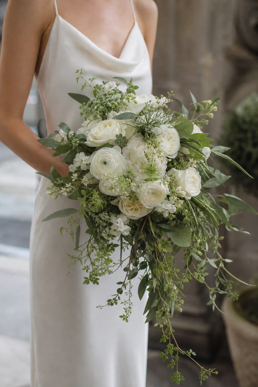 White bridal bouquet with greenery