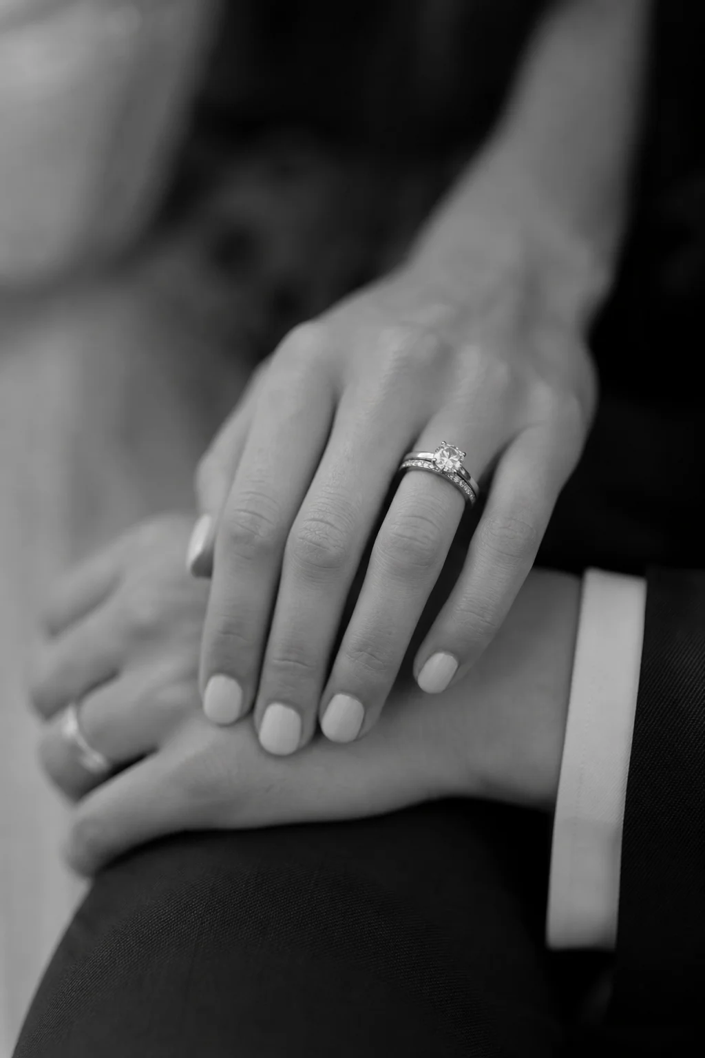 Close-up of hands and wedding rings
