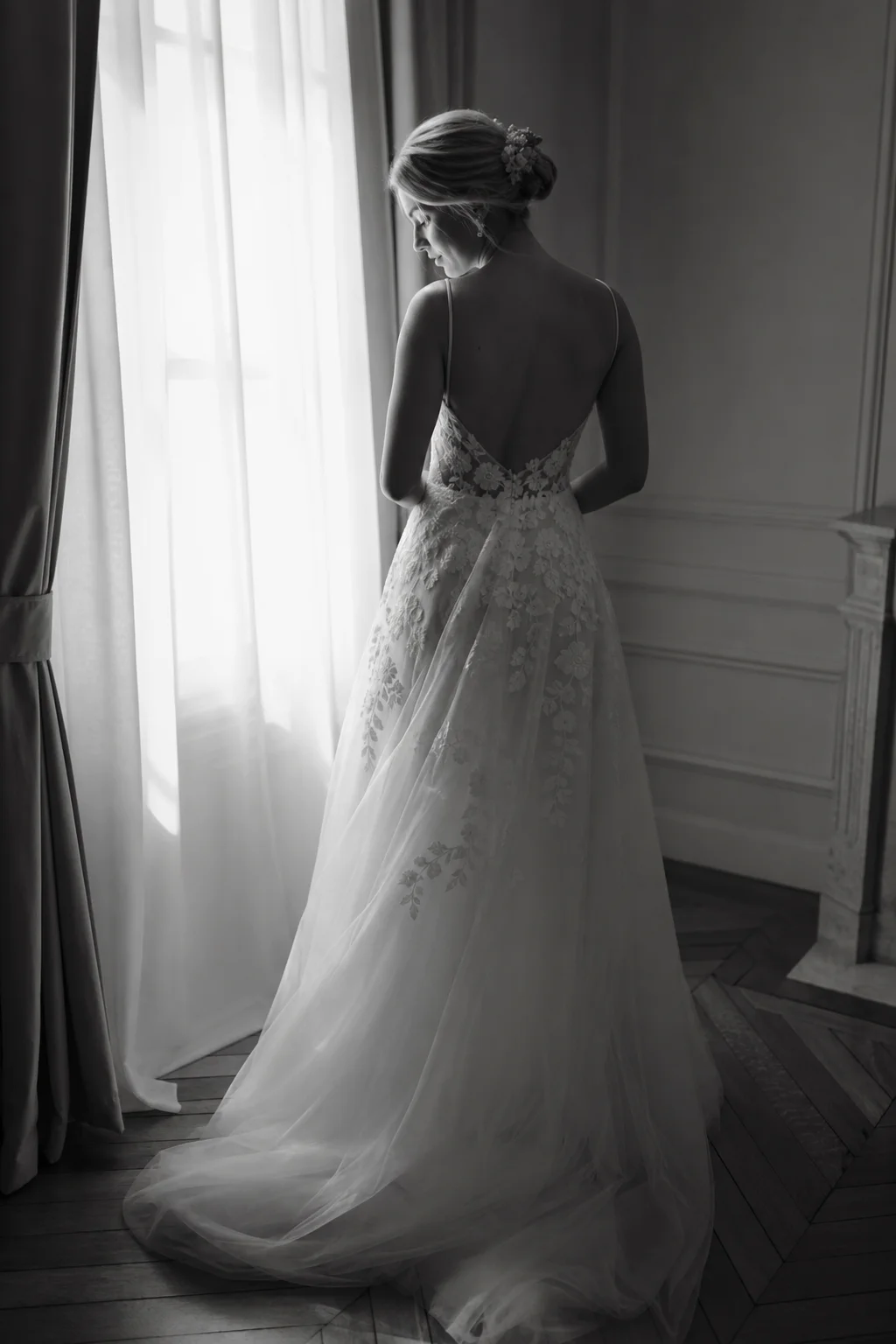 Bride getting ready by a window